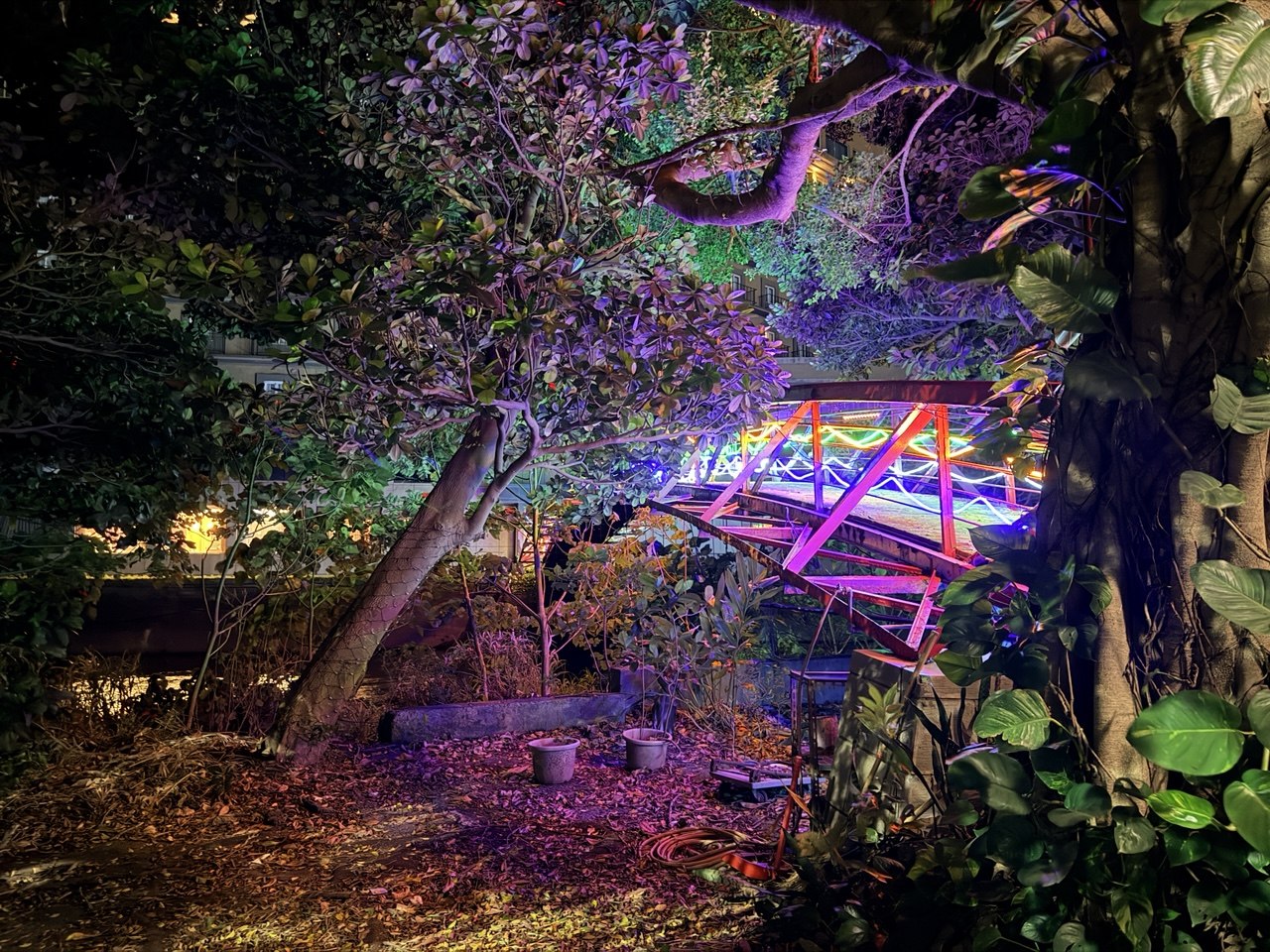 Neon-lit bridge at night